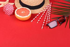 Beach accessories with shells and sea stars on a colored background photo