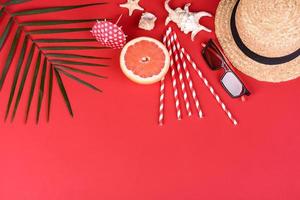 Beach accessories with shells and sea stars on a colored background photo