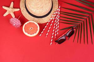 Beach accessories with shells and sea stars on a colored background photo