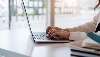 Businesswoman or accountant working on laptop computer photo