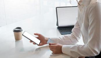 Woman shopping online with credit card using smart phone photo