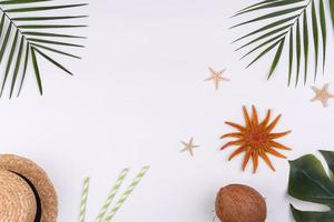 Beach accessories, glasses and hat with shells and sea stars on a colored background photo