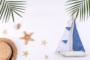 Beach accessories, glasses and hat with shells and sea stars on a colored background photo