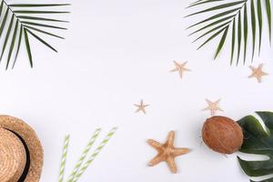 Beach accessories, glasses and hat with shells and sea stars on a colored background photo