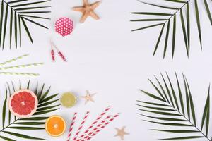 Beach accessories, glasses and hat with shells and sea stars on a colored background photo