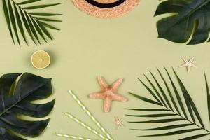 Beach accessories, glasses and hat with shells and sea stars on a colored background photo