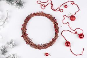 Gifts, fir tree branches, red decorations on white background photo