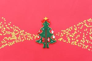 Christmas red decorations, fir tree branches on red background photo