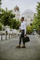 Young African American businessman using a mobile phone photo