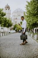 Young African American businessman using a mobile phone photo