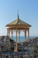 Yellow gazebo among the ruins of Chersonesos photo