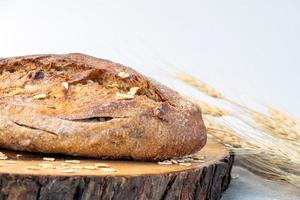 Delicious fresh baked bread on marble background. Healthy diet lifestyle. photo