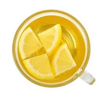 Glass of lemon tea on white background photo