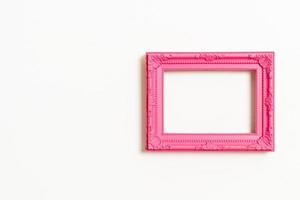 Empty picture frame on white wall background with copy space photo