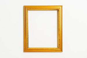 Empty picture frame on white wall background with copy space photo