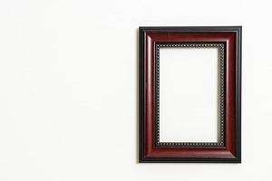 Empty picture frame on white wall background with copy space photo