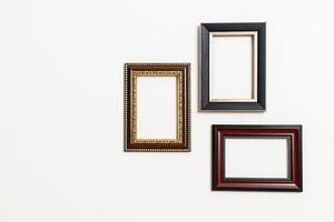 Empty picture frame on white wall background with copy space photo