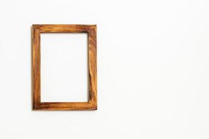 Empty picture frame on white wall background with copy space photo