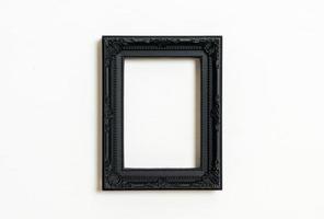 Empty picture frame on white wall background with copy space photo