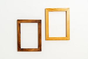 Empty picture frame on white wall background with copy space photo