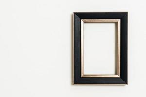 Empty picture frame on white wall background with copy space photo