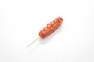 Fried sausage skewer isolated on white background photo