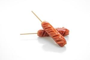 Fried sausage skewer isolated on white background photo