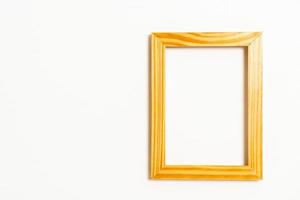 Empty picture frame on white wall background with copy space photo