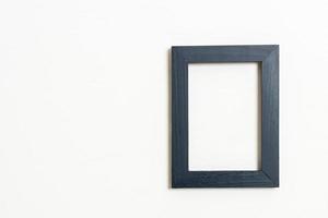 Empty picture frame on white wall background with copy space photo