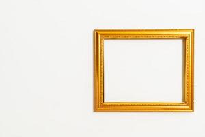 Empty picture frame on white wall background with copy space photo