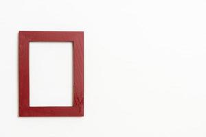 Empty picture frame on white wall background with copy space photo