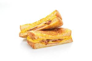 French toast ham, bacon, and cheese sandwich with egg isolated on white background photo