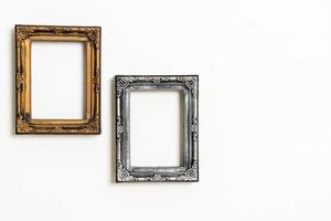 Empty picture frame on white wall background with copy space photo