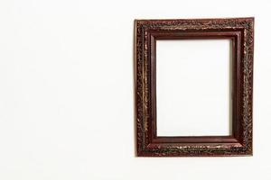 Empty picture frame on white wall background with copy space photo