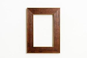 Empty picture frame on white wall background with copy space photo