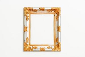 Empty picture frame on white wall background with copy space photo