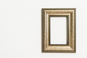 Empty picture frame on white wall background with copy space photo