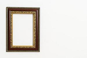 Empty picture frame on white wall background with copy space photo