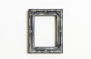 Empty picture frame on white wall background with copy space photo