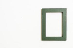 Empty picture frame on white wall background with copy space photo