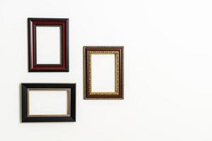 Empty picture frame on white wall background with copy space photo