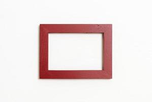 Empty picture frame on white wall background with copy space photo