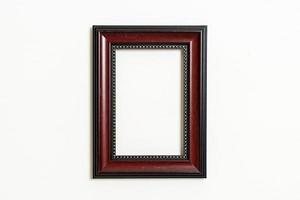 Empty picture frame on white wall background with copy space photo