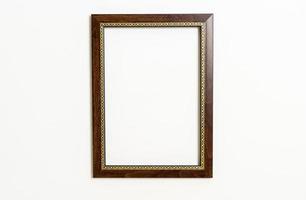 Empty picture frame on white wall background with copy space photo