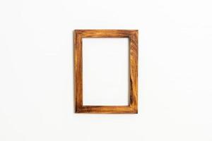 Empty picture frame on white wall background with copy space photo