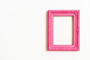 Empty picture frame on white wall background with copy space photo