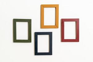 Empty picture frame on white wall background with copy space photo