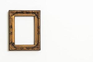 Empty picture frame on white wall background with copy space photo