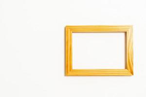 Empty picture frame on white wall background with copy space photo