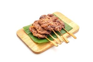 Grilled skewered milk pork with white sticky rice - local Thai street food style